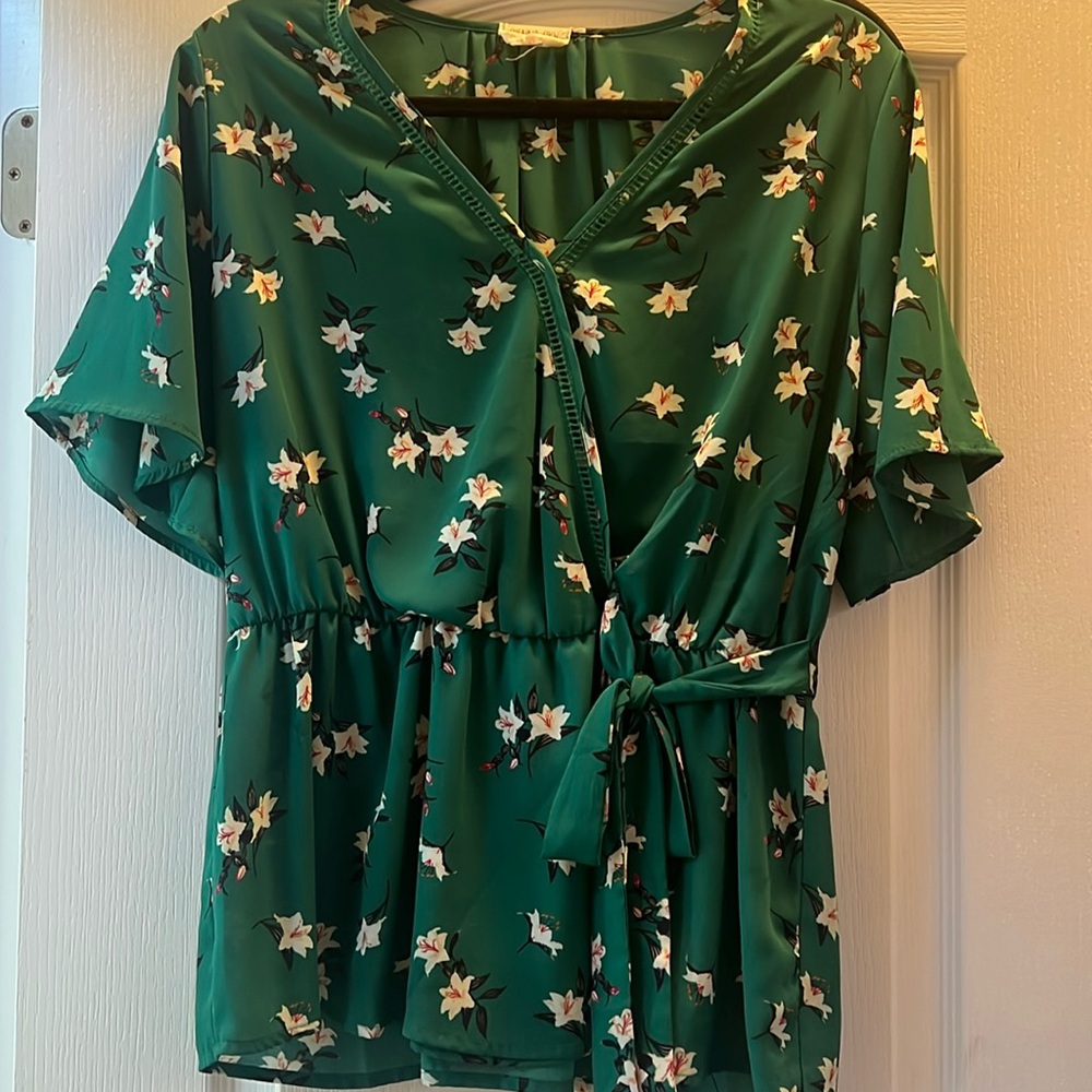 Green floral across tie peplum style blouse